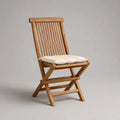 Sedia pieghevole da giardino in legno massello di acacia marrone naturale con cuscino crema, 47 x 58 x 91 cm